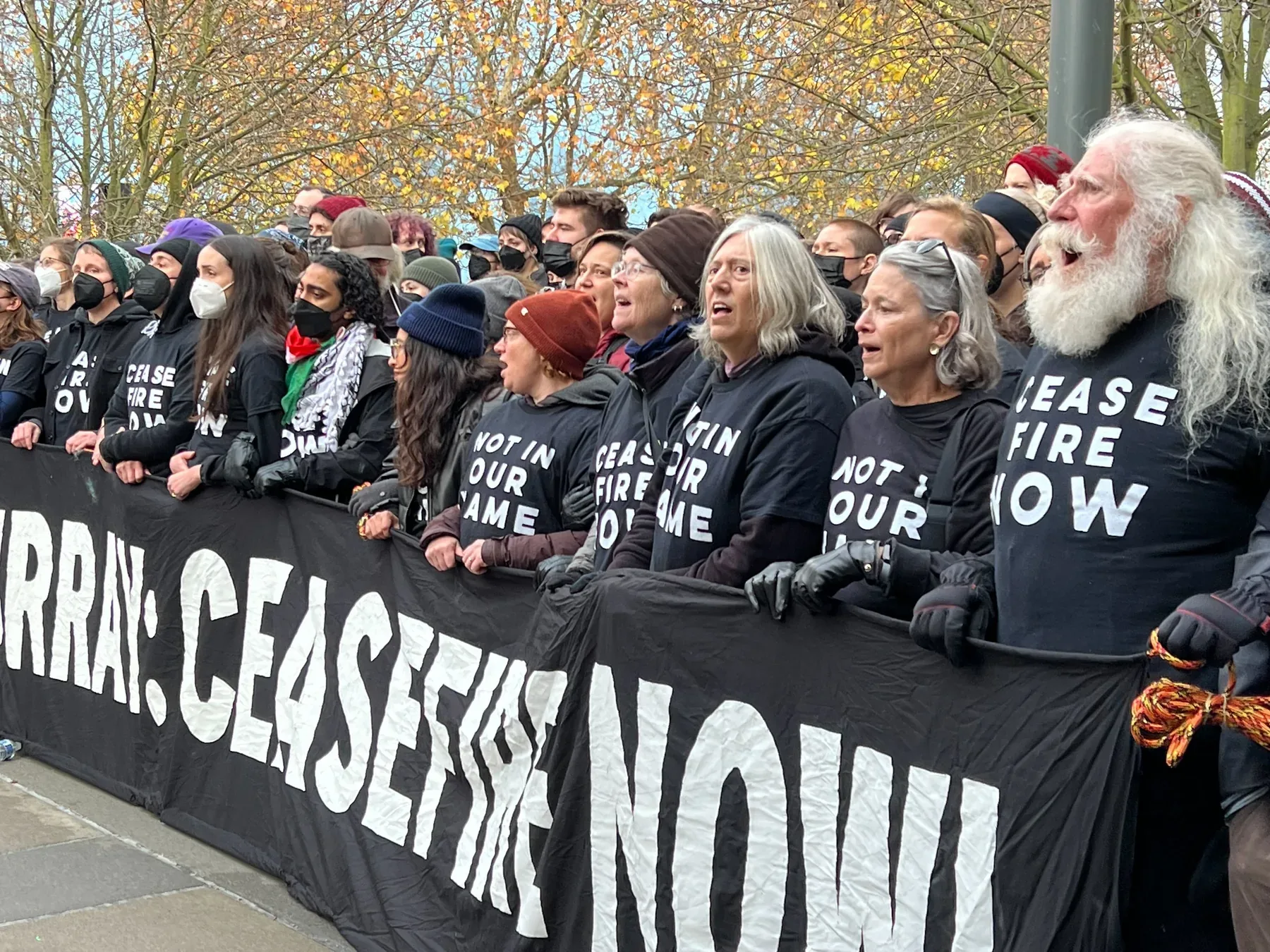 Jewish Voice For Peace demonstration, equipped with custom printed signs and t-shirts
